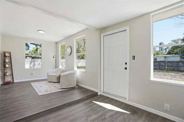 a living room with furniture and a window