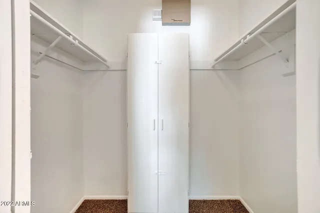 a view of an empty room with windows