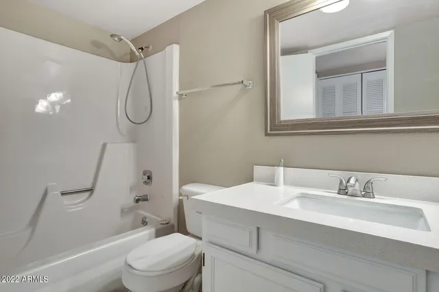 a bathroom with a sink and vanity