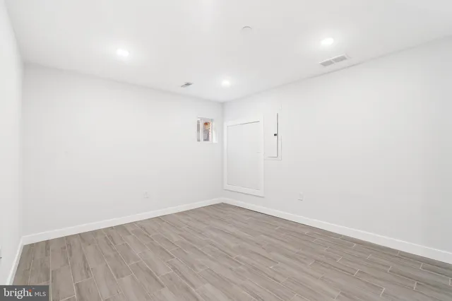 wooden floor in a hall with a window