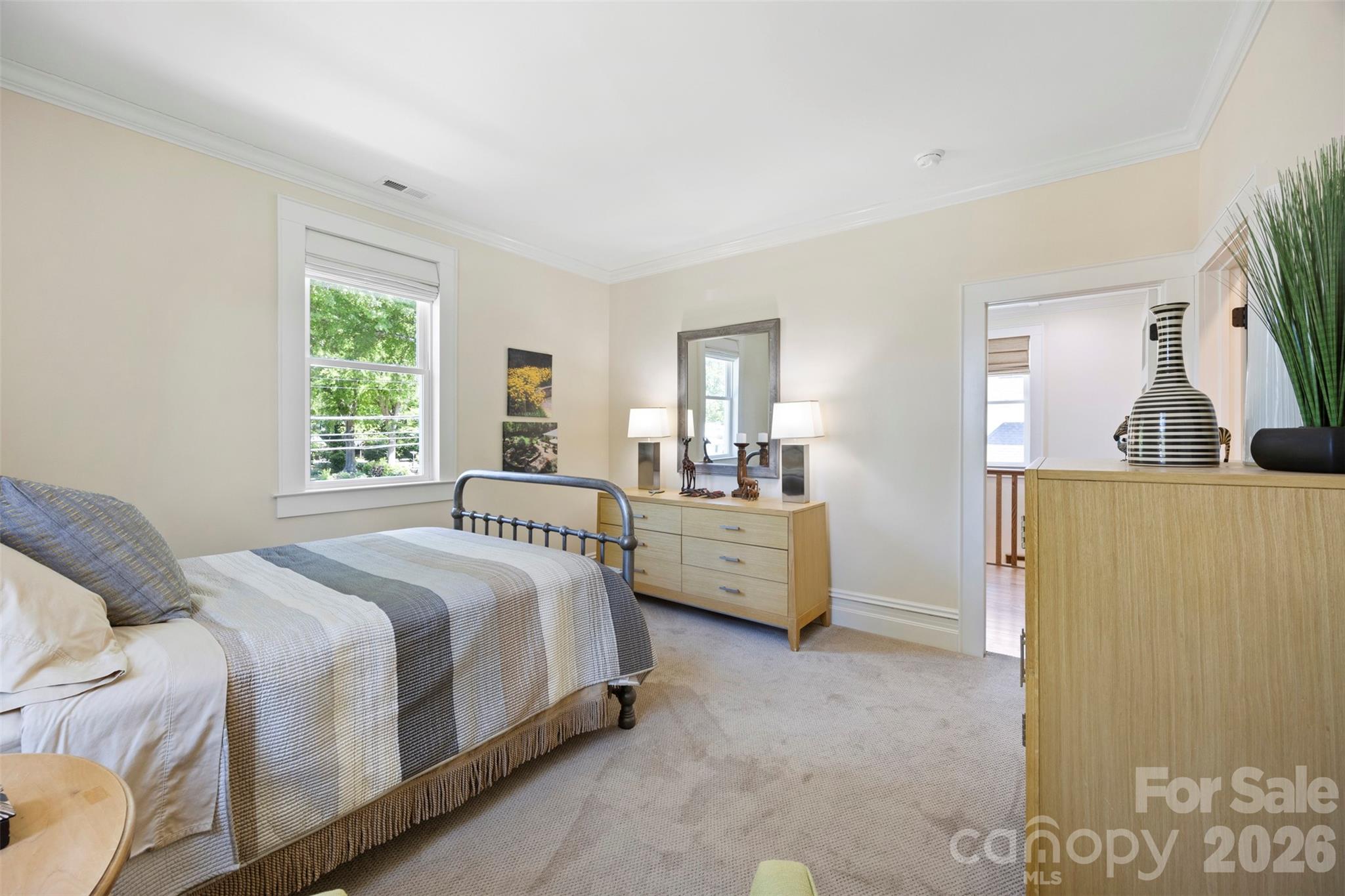 207 West Academy Street Cherryville, NC 28021 - Photo 38 of 45 a bedroom with a bed a couch and dresser