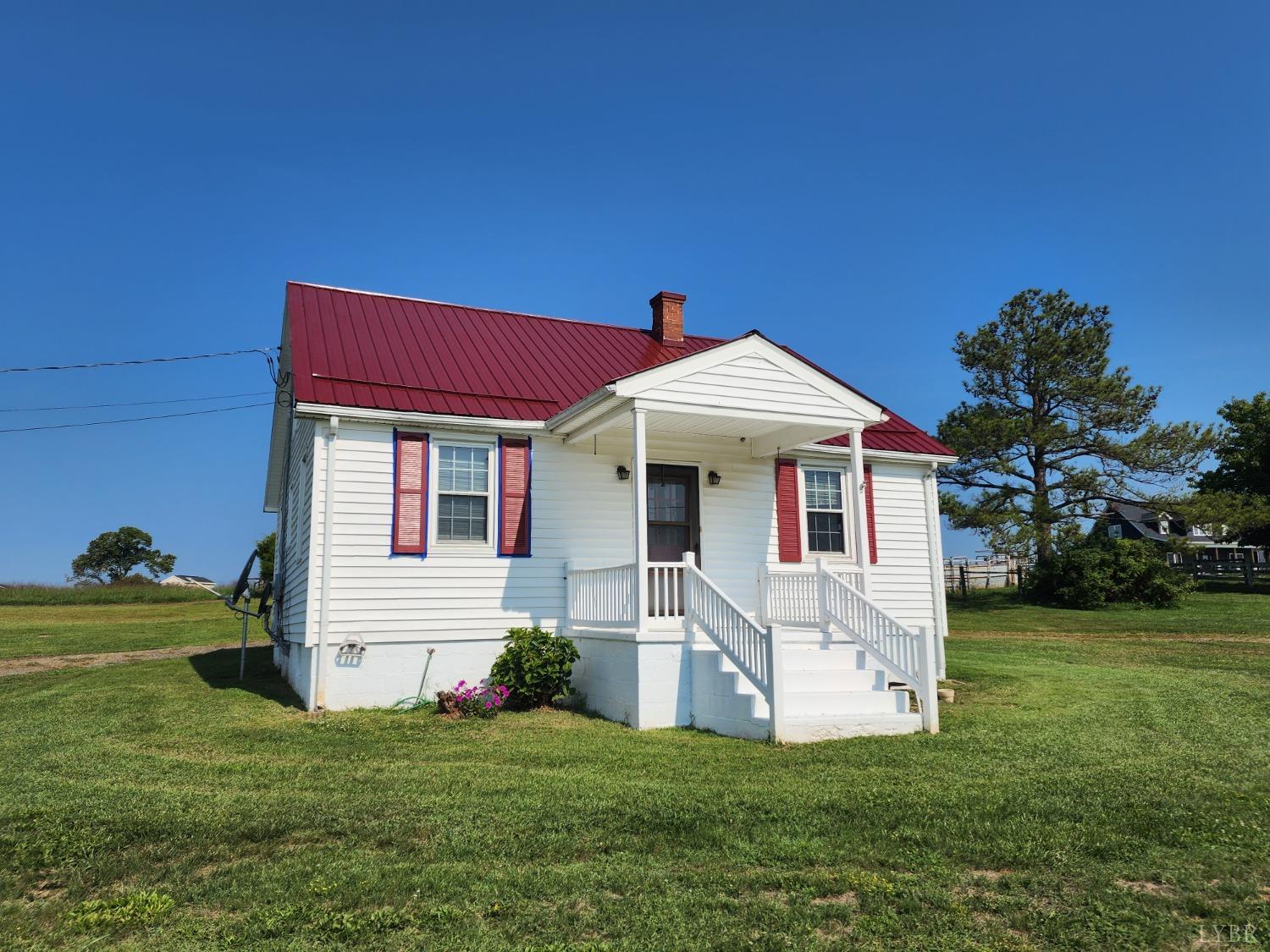 175 Trinity Road Concord, VA 24538 - Photo 1 of 15 a front view of a house with a yard