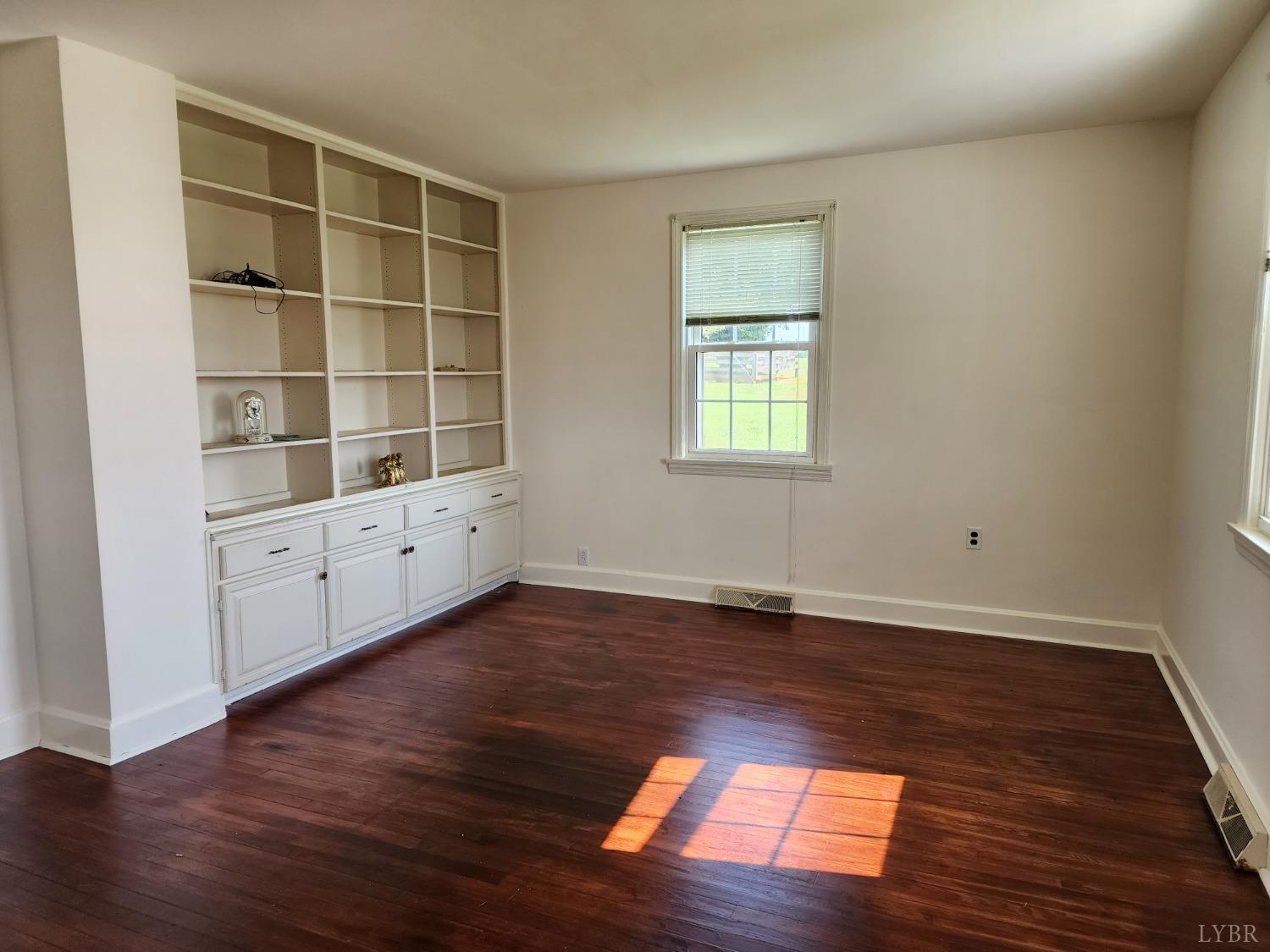 175 Trinity Road Concord, VA 24538 - Photo 7 of 15 a view of an empty room with wooden floor and a window