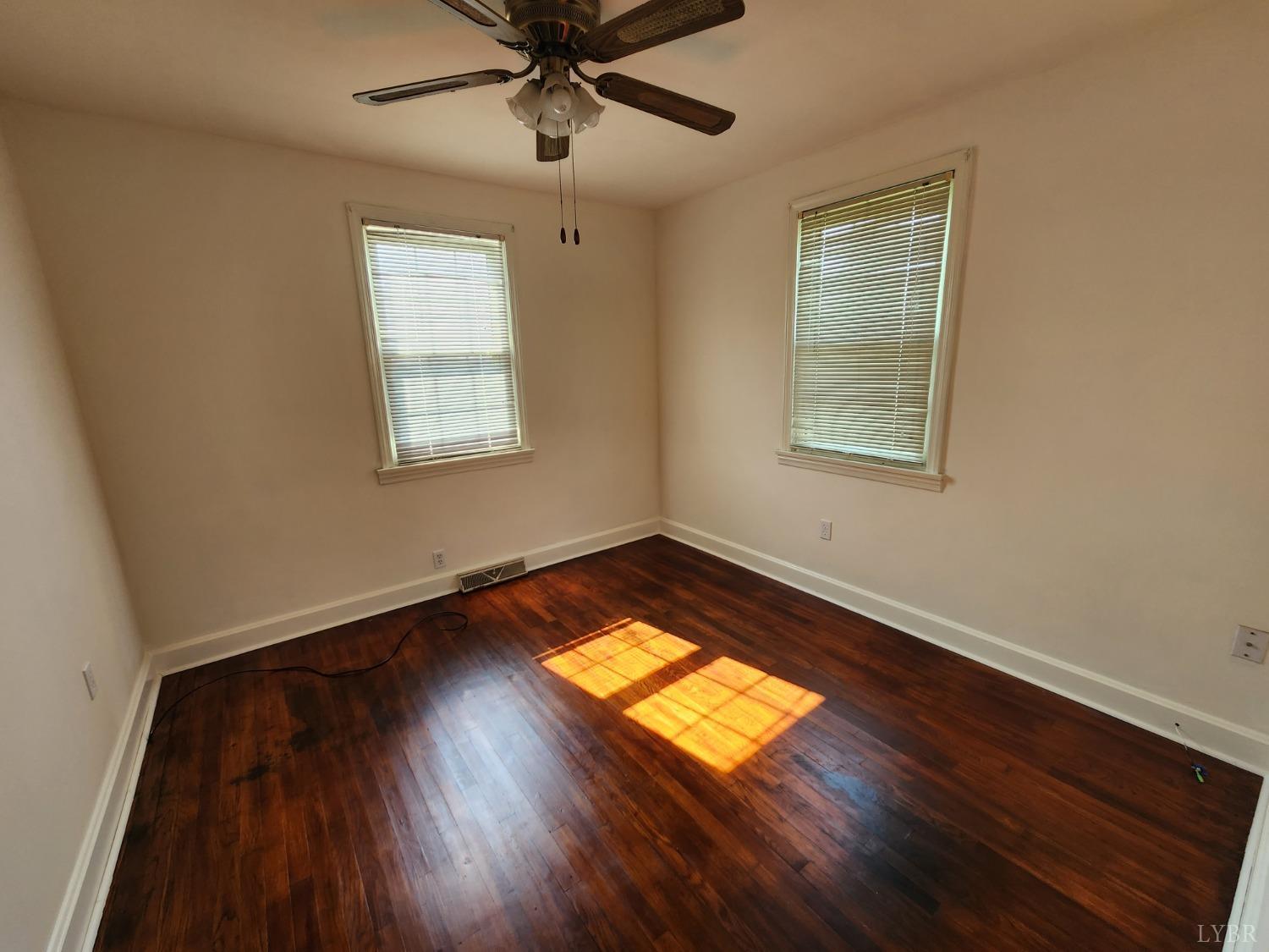 175 Trinity Road Concord, VA 24538 - Photo 10 of 15 a view of empty room with wooden floor and fan