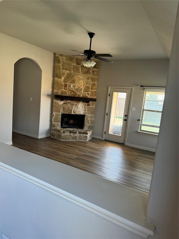 236 Archer Way Forney, TX 75126 - Photo 4 of 35 a living room with fireplace furniture and a wooden floor
