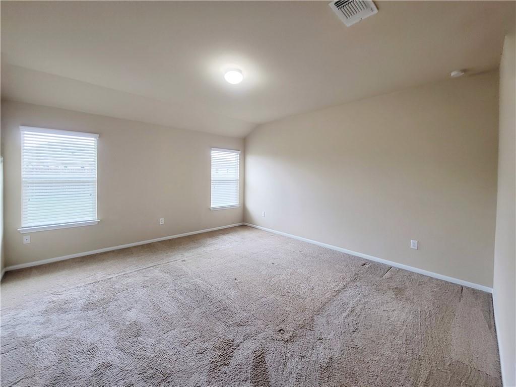 11924 Riparian Road Manor, TX 78653 - Photo 7 of 14 an empty room with windows