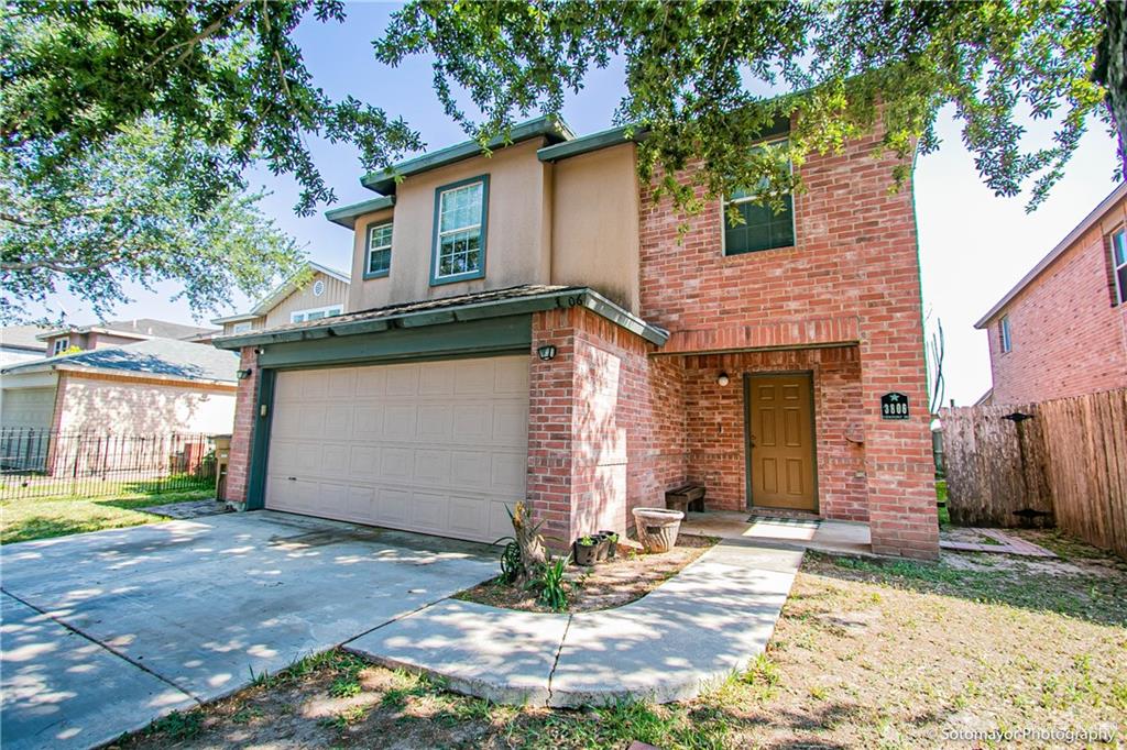 3806 View Point Drive Edinburg, TX 78542 - Photo 1 of 1 a front view of a house with a yard and garage