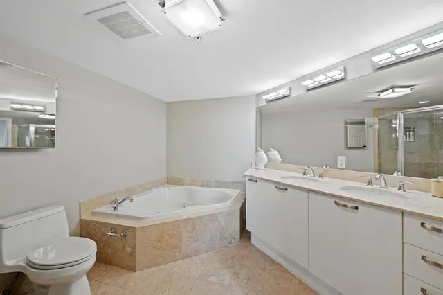 a bathroom with a toilet and shower
