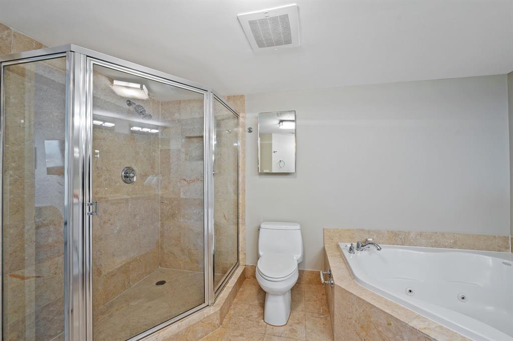 2011 North Ocean Boulevard, Unit 1605 Fort Lauderdale, FL 33305 - Photo 16 of 52 a bathroom with a toilet and shower
