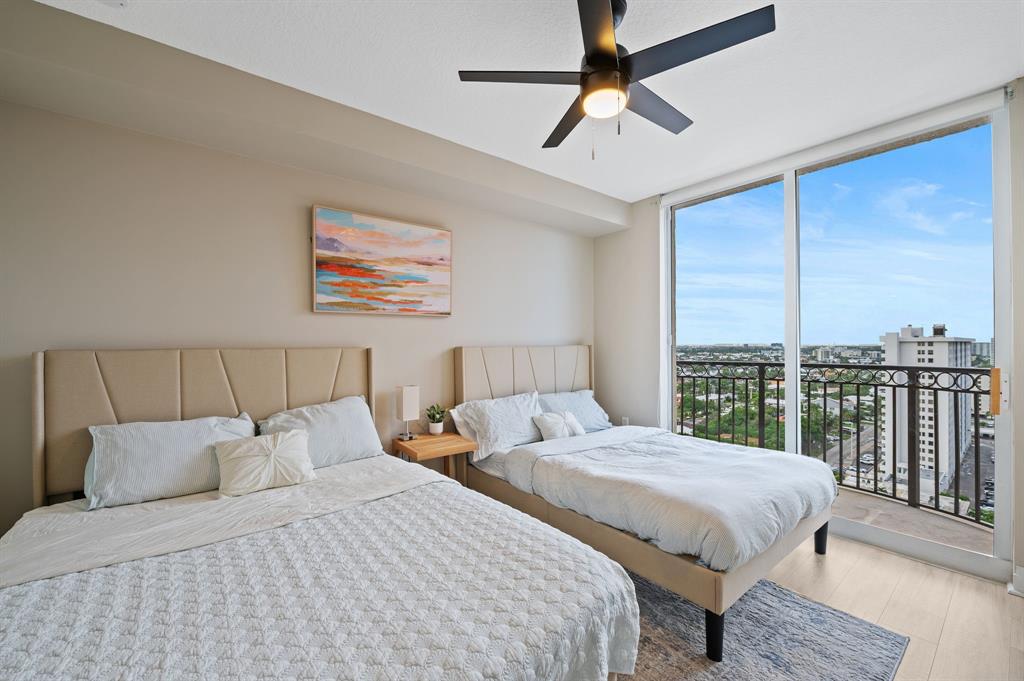 2011 North Ocean Boulevard, Unit 1605 Fort Lauderdale, FL 33305 - Photo 21 of 52 a bedroom with double bed and a large window