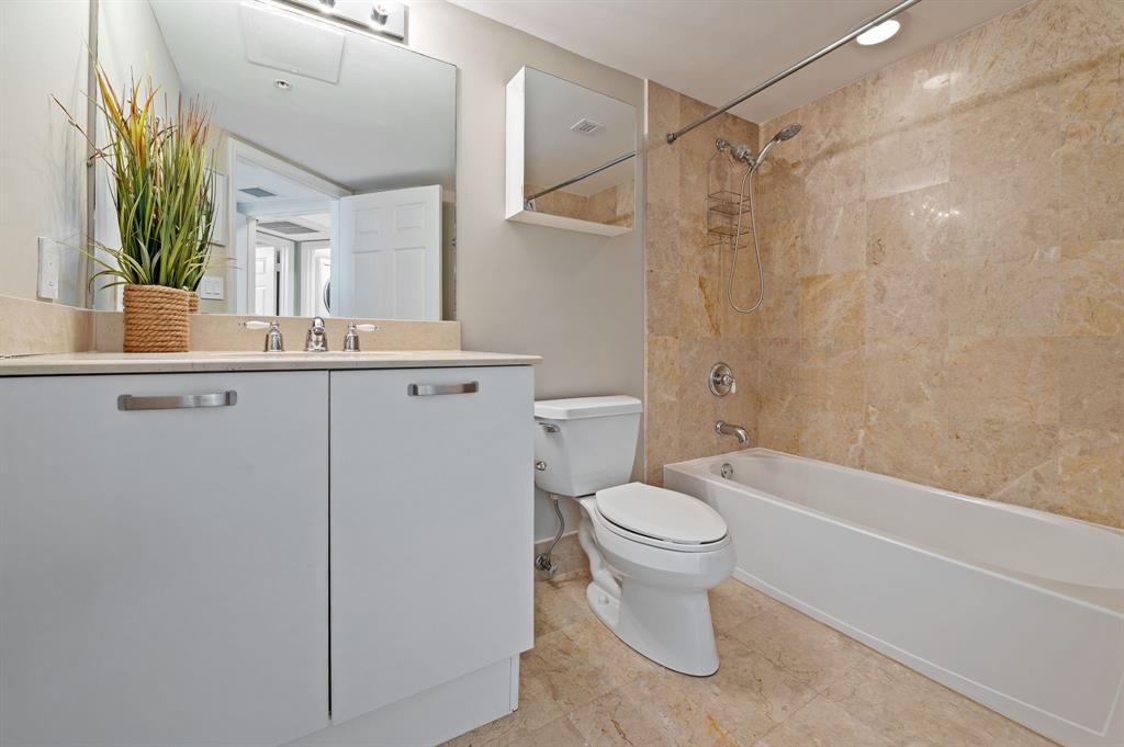 2011 North Ocean Boulevard, Unit 1605 Fort Lauderdale, FL 33305 - Photo 23 of 52 a bathroom with a sink a toilet and shower