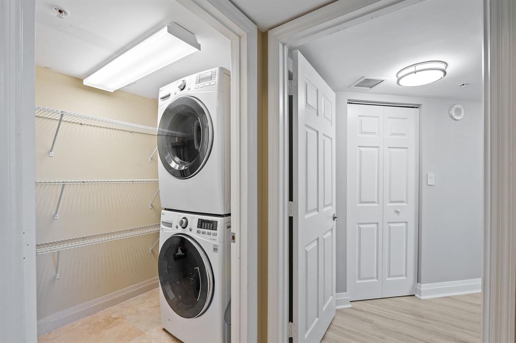 2011 North Ocean Boulevard, Unit 1605 Fort Lauderdale, FL 33305 - Photo 24 of 52 a utility room with dryer washer and a view of bedroom
