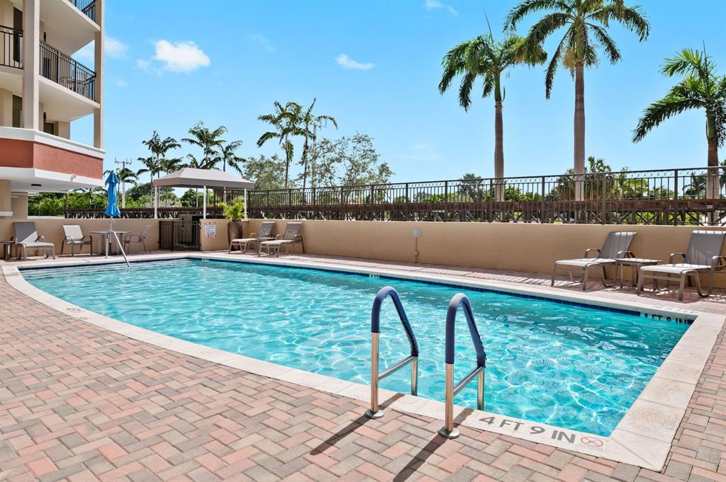 2011 North Ocean Boulevard, Unit 1605 Fort Lauderdale, FL 33305 - Photo 25 of 52 a swimming pool with outdoor seating and yard