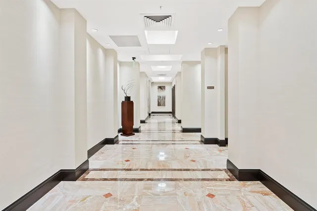 a living room with furniture a rug and a table