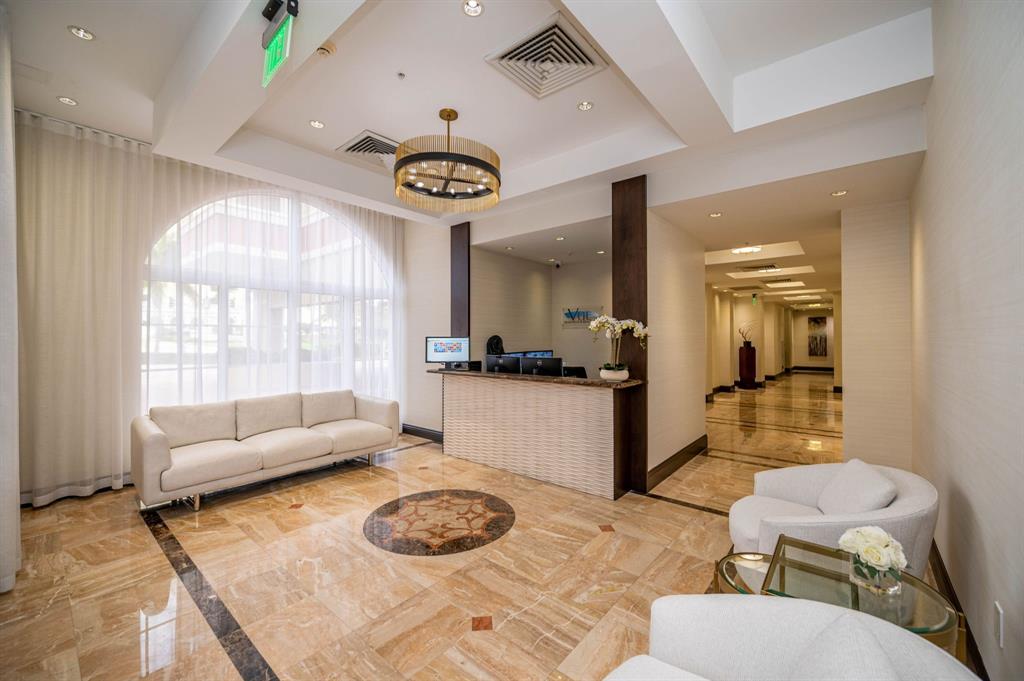 2011 North Ocean Boulevard, Unit 1605 Fort Lauderdale, FL 33305 - Photo 34 of 52 a living room with furniture and a large window