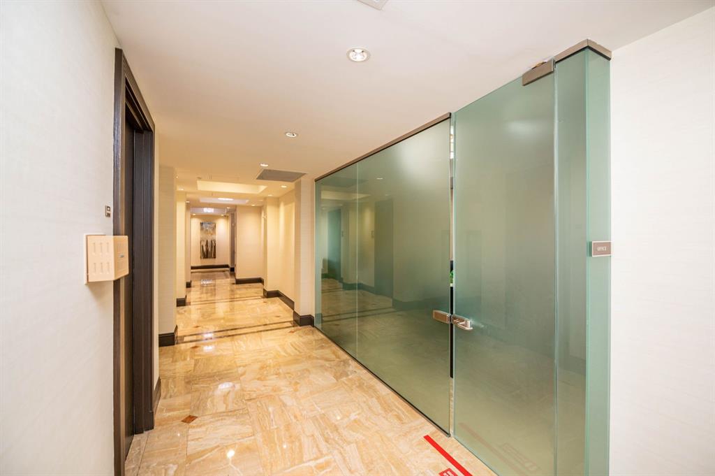 2011 North Ocean Boulevard, Unit 1605 Fort Lauderdale, FL 33305 - Photo 38 of 52 a bathroom with a glass shower door and a mirror