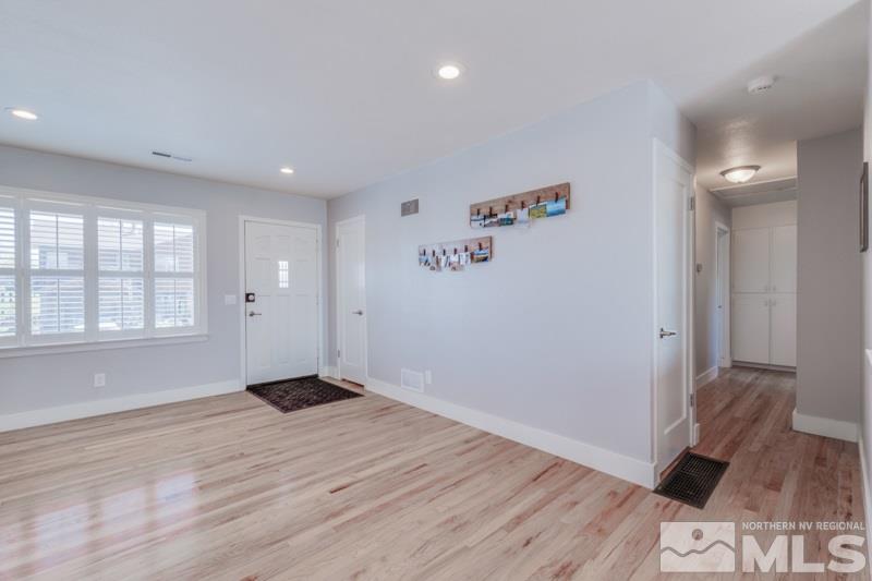 1695 Lander Street Reno, NV 89509 - Photo 11 of 38 an empty room with wooden floor and windows