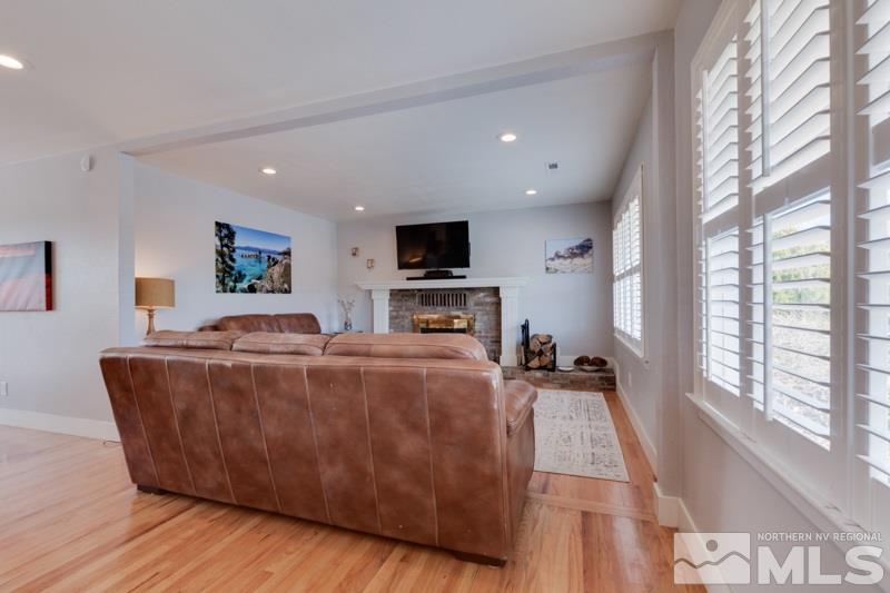 1695 Lander Street Reno, NV 89509 - Photo 13 of 38 a living room with furniture and a flat screen tv