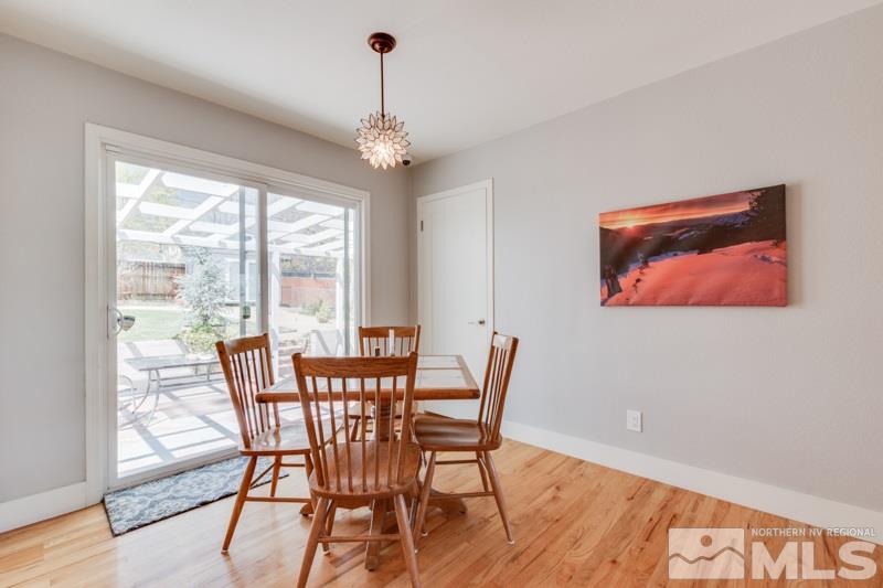 1695 Lander Street Reno, NV 89509 - Photo 15 of 38 a view of a dining room with furniture window and wooden floor