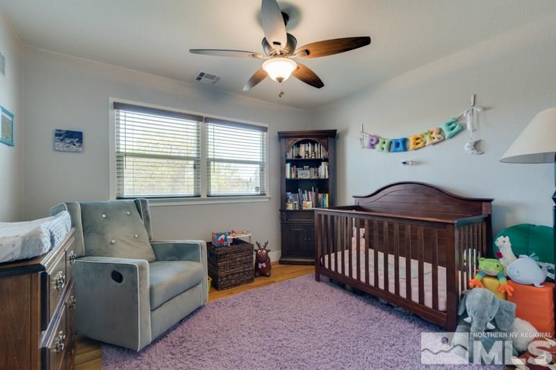 1695 Lander Street Reno, NV 89509 - Photo 22 of 38 a bedroom with furniture and a window