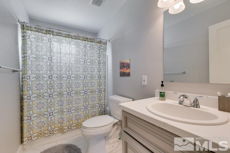 1695 Lander Street Reno, NV 89509 - Photo 23 of 38 a bathroom with a sink toilet and shower