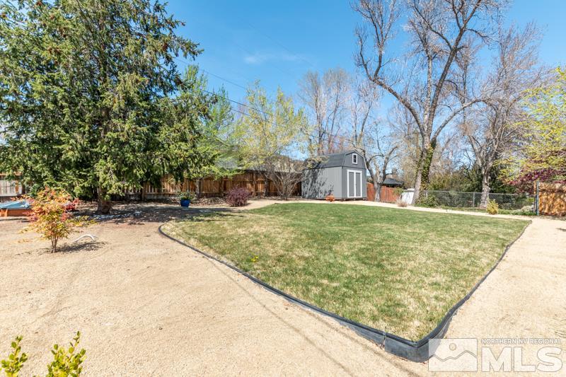 1695 Lander Street Reno, NV 89509 - Photo 26 of 38 a view of a yard with large trees