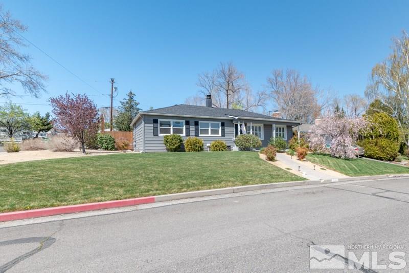 1695 Lander Street Reno, NV 89509 - Photo 5 of 38 a front view of a house with a yard