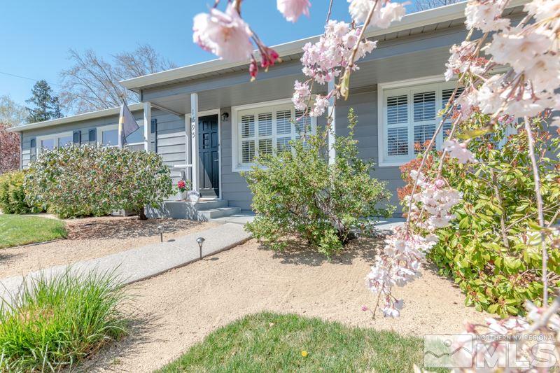 1695 Lander Street Reno, NV 89509 - Photo 10 of 38 a front view of a house with a yard and outdoor seating