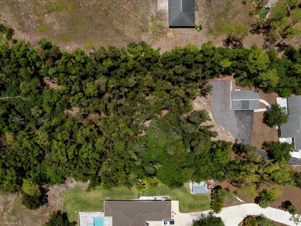6800 Bottlebrush Lane Naples, FL 34109 - Photo 12 of 12 an aerial view of a house with a yard