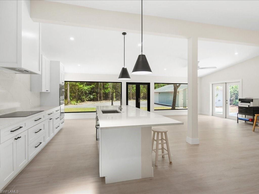 6800 Bottlebrush Lane Naples, FL 34109 - Photo 2 of 12 a view of living room with furniture and floor to ceiling windows