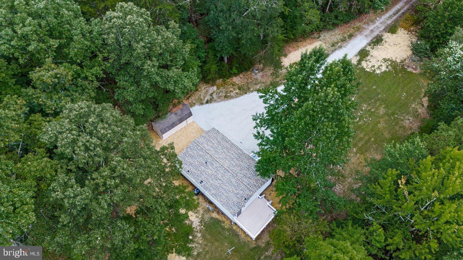 20105 Sparta Road Milford, VA 22514 - Photo 34 of 48 an aerial view of a house with a yard and wooden fence