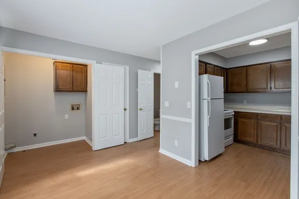 a kitchen with stainless steel appliances a refrigerator and a stove top oven