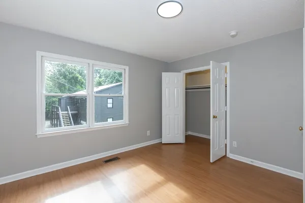 a view of an empty room with a window