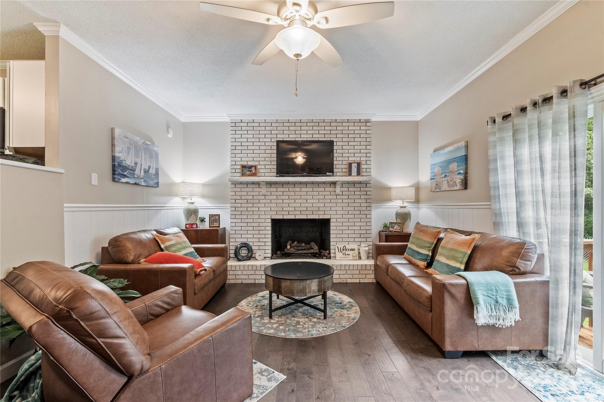 4515 Diamond Street Hudson, NC 28638 - Photo 12 of 26 a living room with furniture and a fireplace
