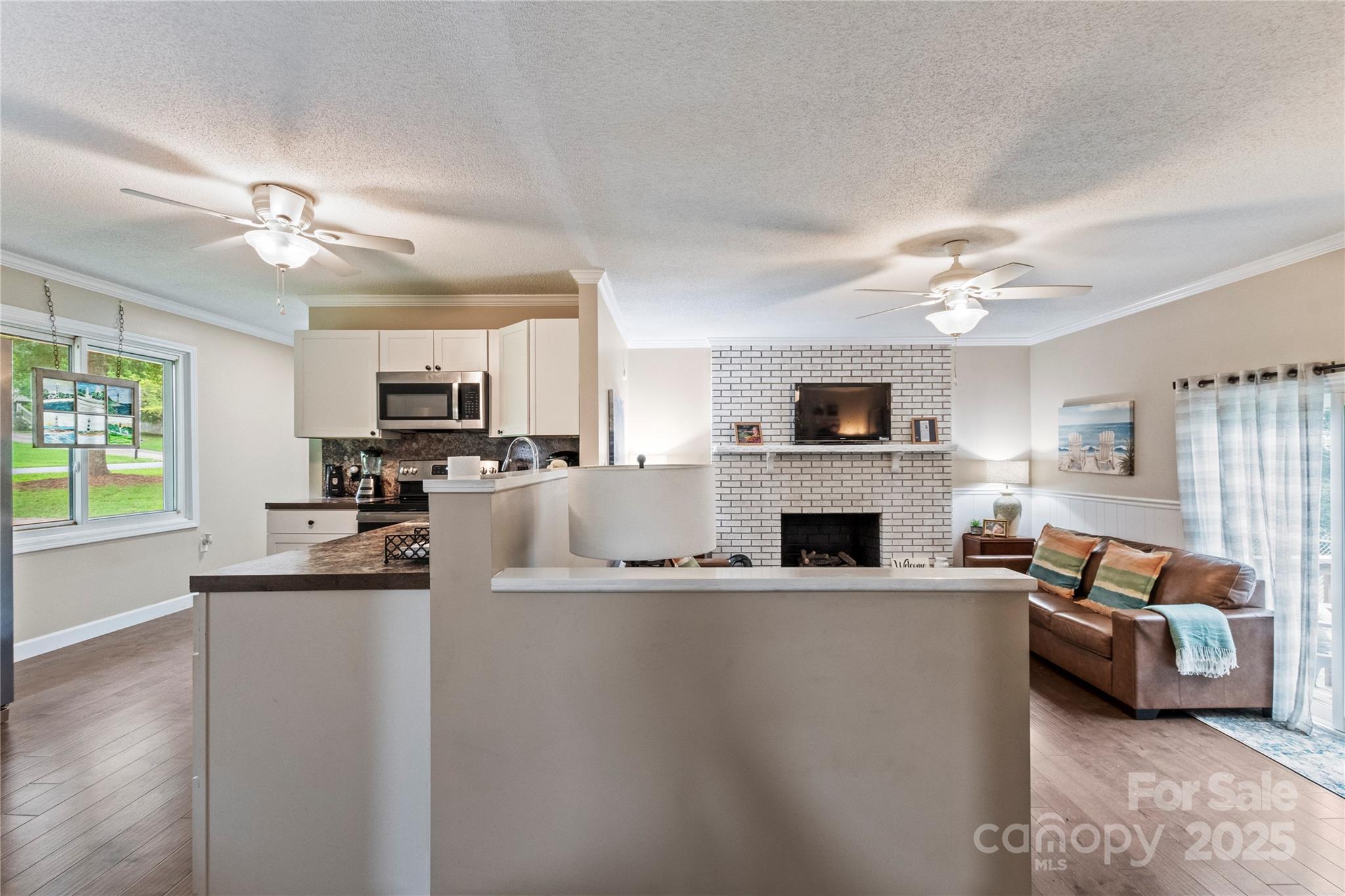 4515 Diamond Street Hudson, NC 28638 - Photo 13 of 26 a kitchen with stainless steel appliances a sink cabinets and microwave