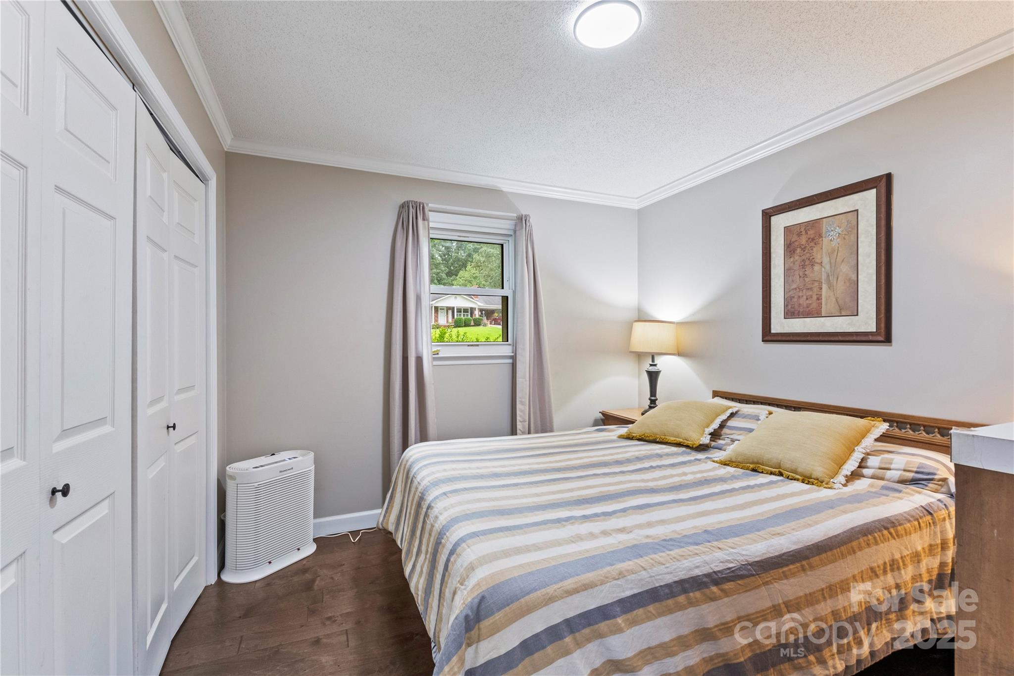 4515 Diamond Street Hudson, NC 28638 - Photo 18 of 26 a bedroom with a bed and a lamp