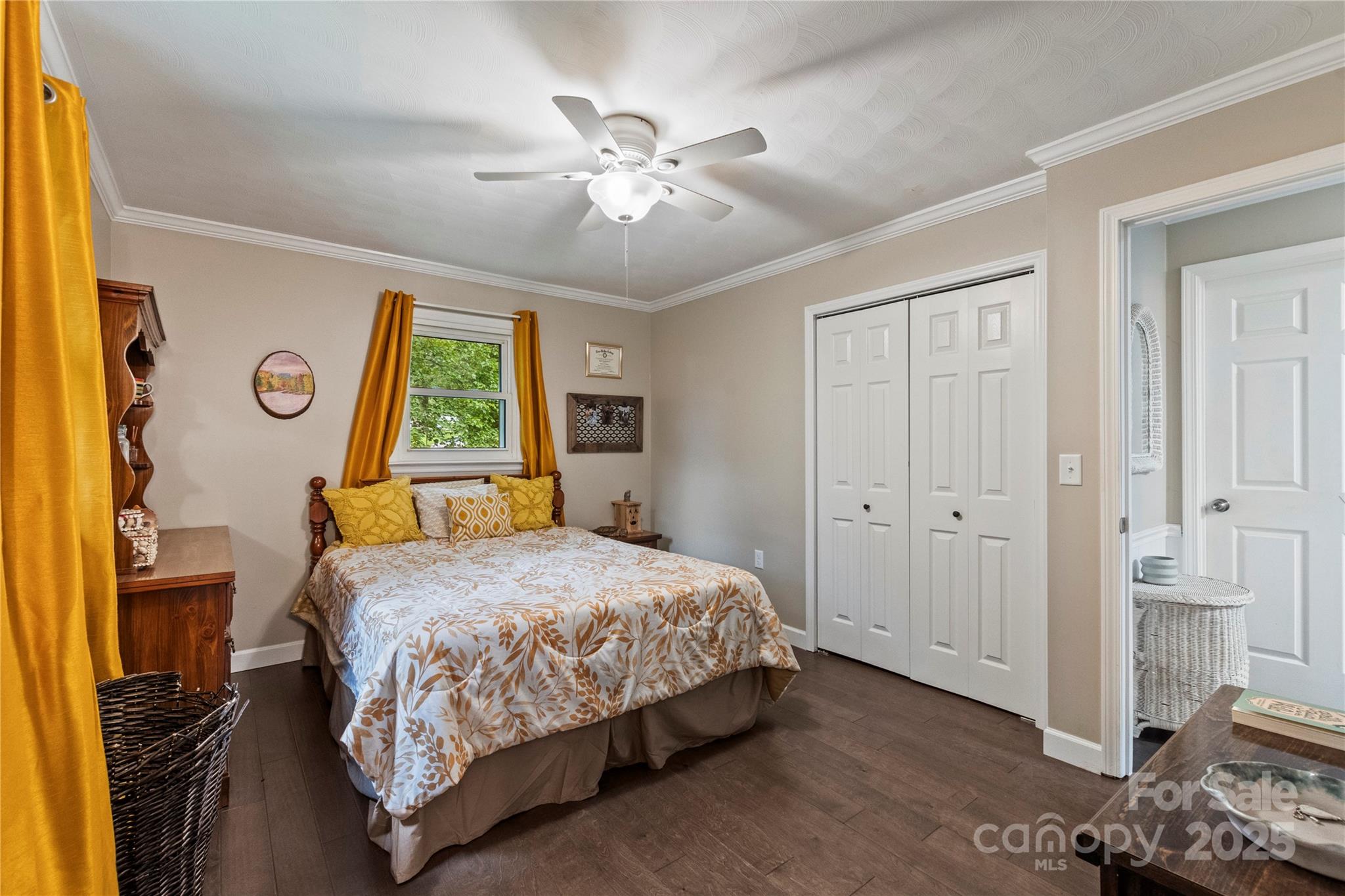 4515 Diamond Street Hudson, NC 28638 - Photo 19 of 26 a bedroom with a bed and a chandelier
