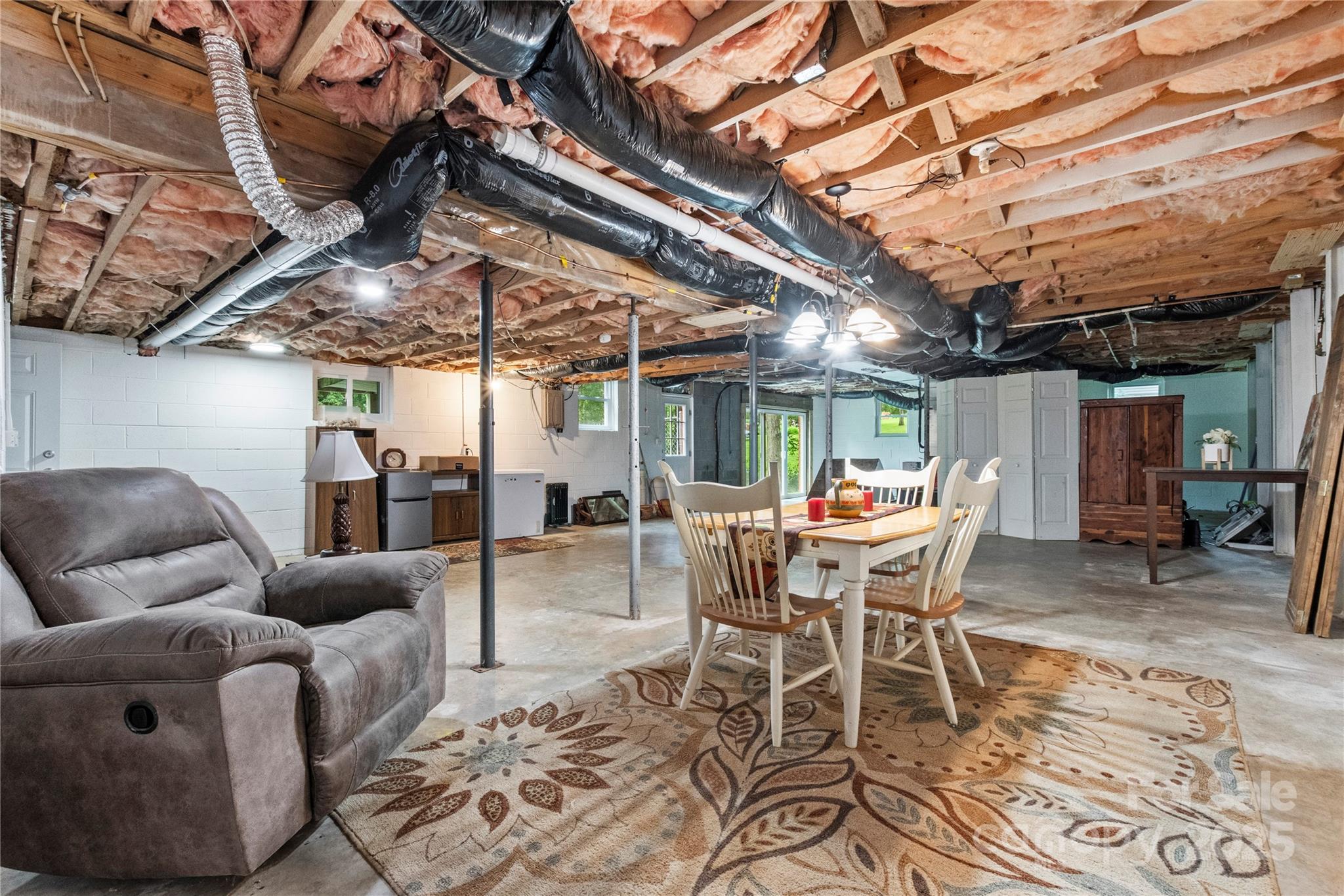4515 Diamond Street Hudson, NC 28638 - Photo 25 of 26 a dining room with furniture and a chandelier