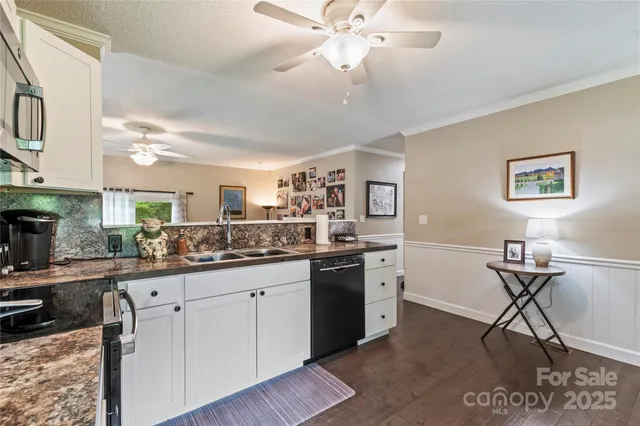 a kitchen with a sink cabinets and window