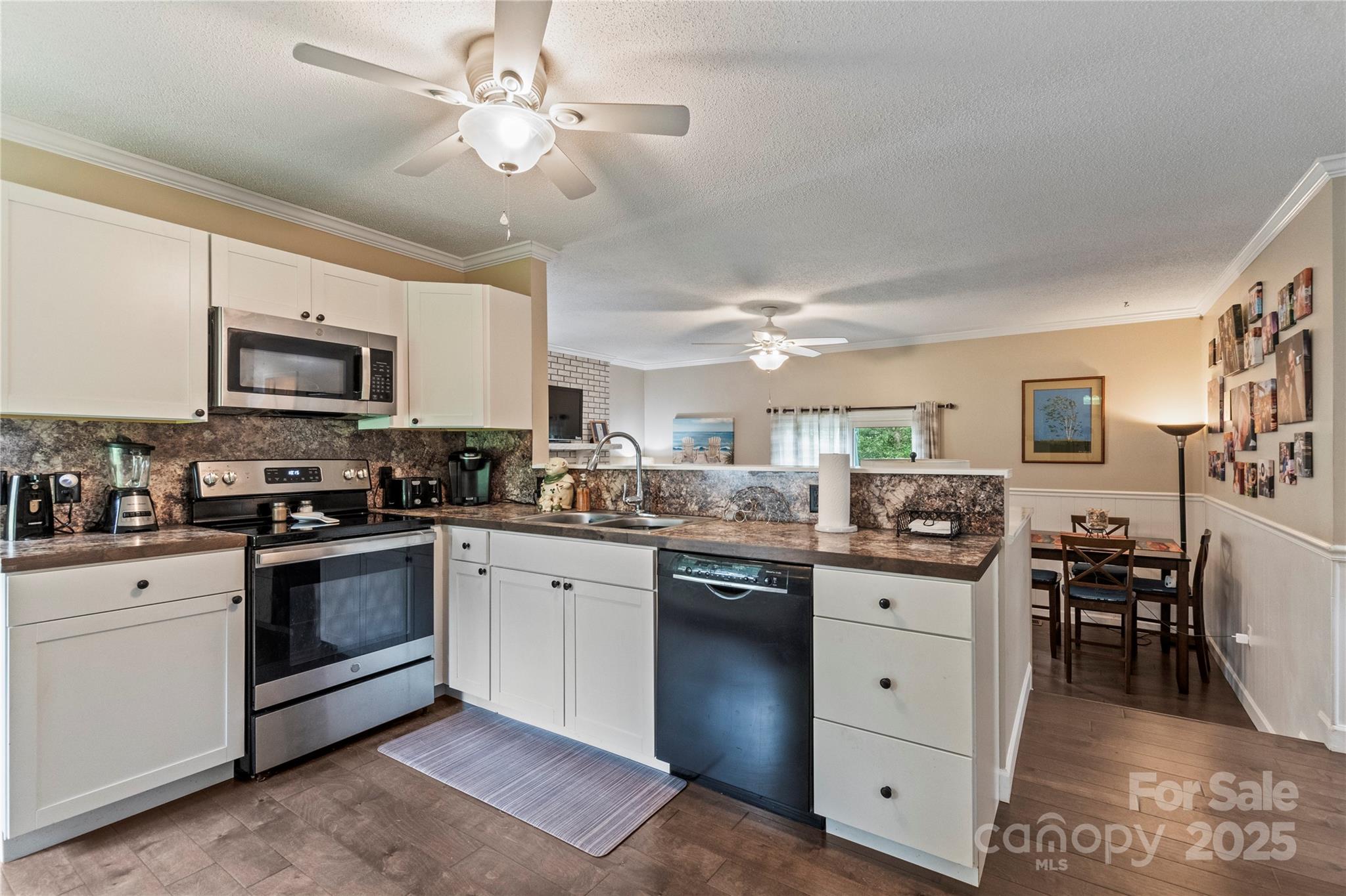 4515 Diamond Street Hudson, NC 28638 - Photo 8 of 26 a kitchen with a sink stove and microwave