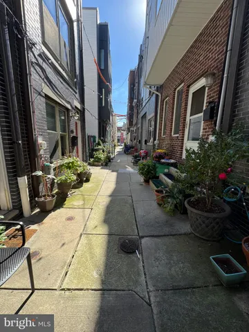 a view of a building with potted plants