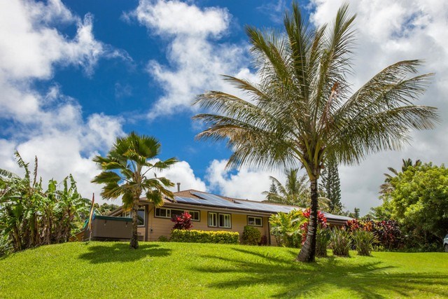 894 East Kuiaha Road Haiku, HI 96708 - Photo 7 of 11 a front view of a house with a garden