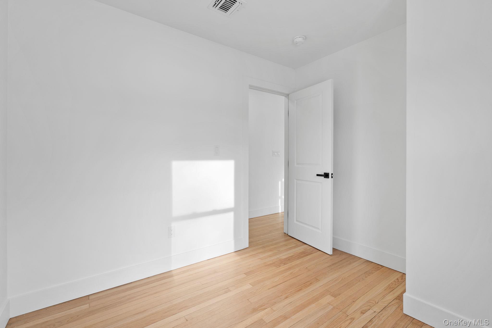 52 Rudolph Road Modena, NY 12548 - Photo 20 of 49 Unfurnished room featuring light wood-style flooring and baseboards