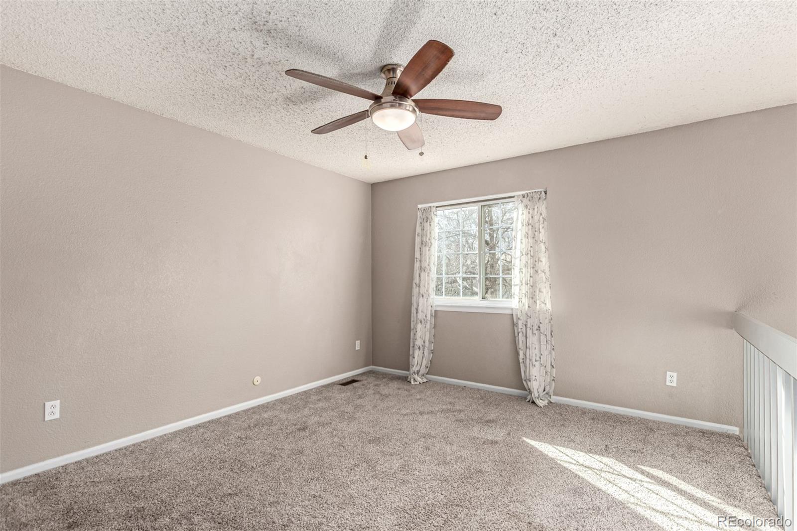 3623 West Rosewalk Circle Highlands Ranch, CO 80129 - Photo 22 of 44 a view of an empty room with a window