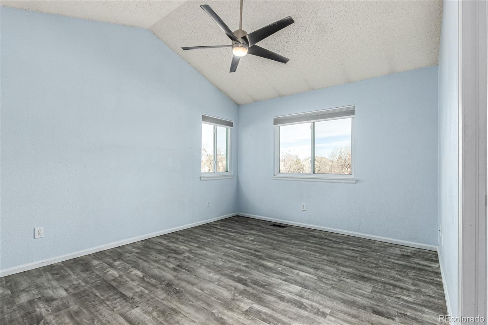 3623 West Rosewalk Circle Highlands Ranch, CO 80129 - Photo 23 of 44 wooden floor in an empty room with a window