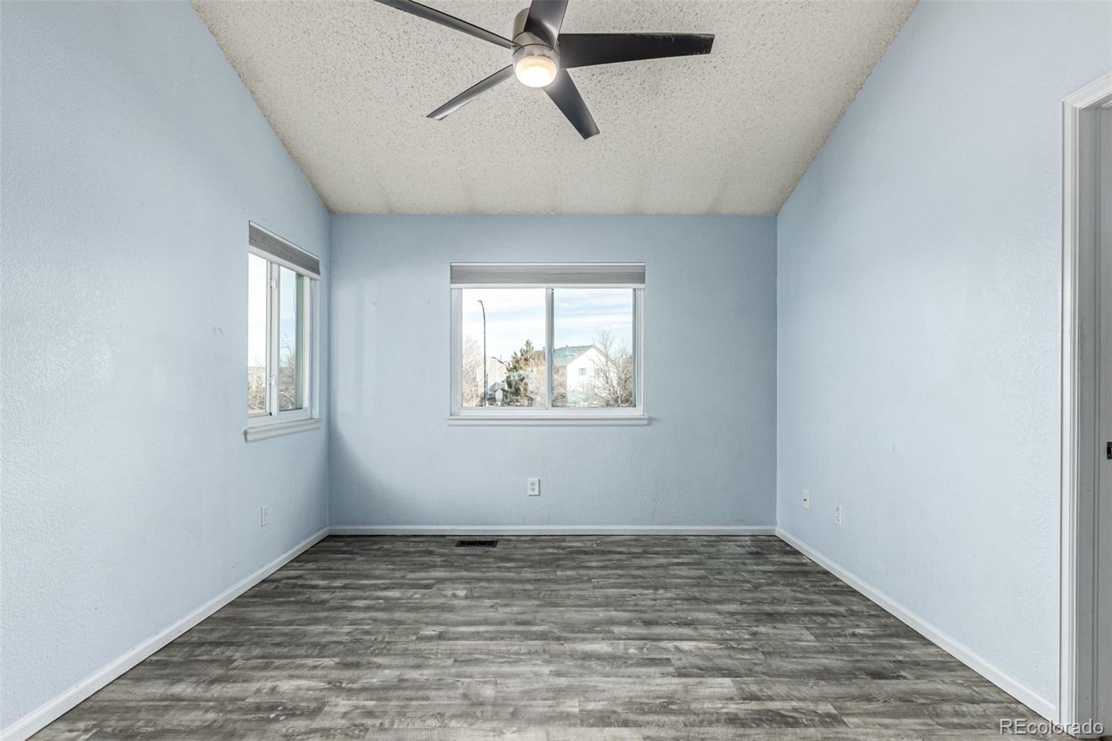 3623 West Rosewalk Circle Highlands Ranch, CO 80129 - Photo 24 of 44 wooden floor in an empty room with a window