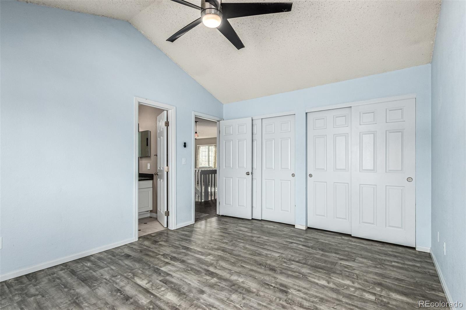 3623 West Rosewalk Circle Highlands Ranch, CO 80129 - Photo 25 of 44 a view of a livingroom with wooden floor and a ceiling fan