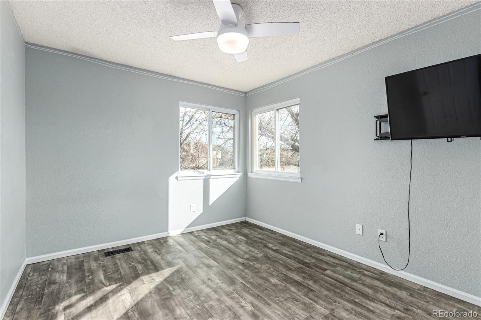 3623 West Rosewalk Circle Highlands Ranch, CO 80129 - Photo 27 of 44 a view of a livingroom with a flat screen tv