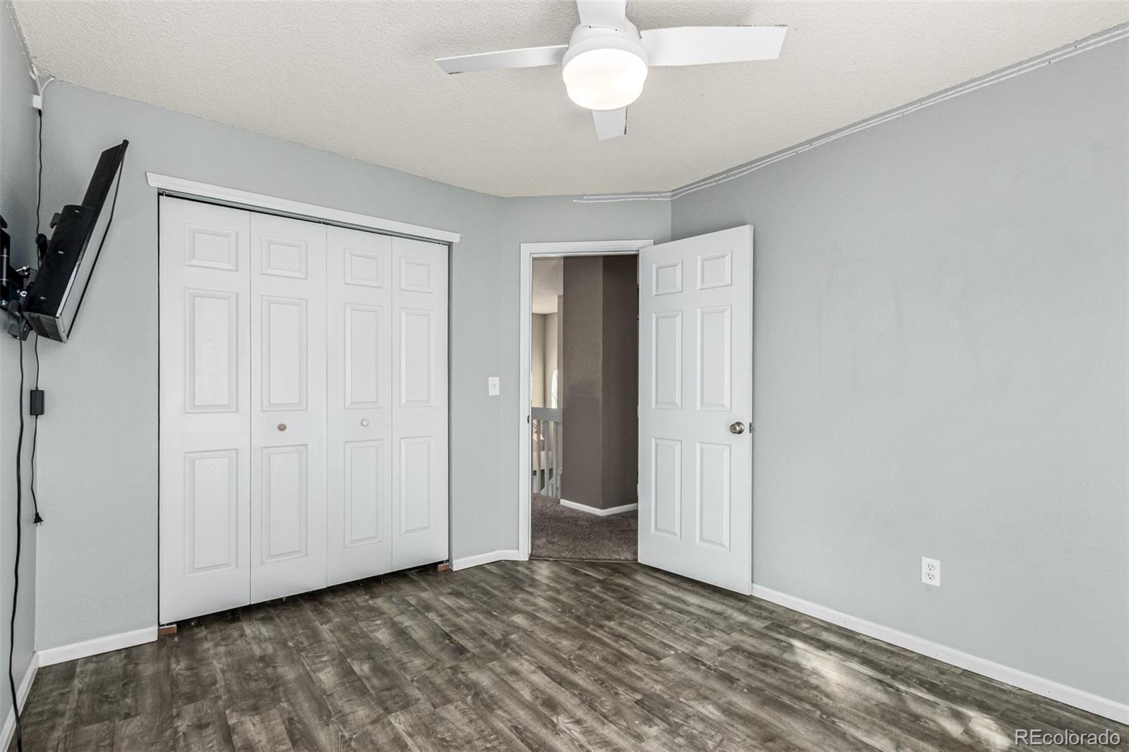 3623 West Rosewalk Circle Highlands Ranch, CO 80129 - Photo 28 of 44 a view of an empty room with wooden floor