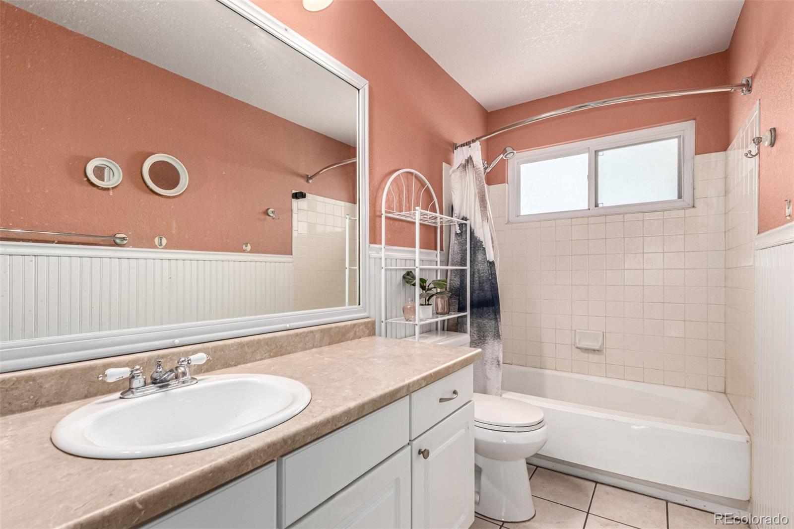 3623 West Rosewalk Circle Highlands Ranch, CO 80129 - Photo 31 of 44 a bathroom with a sink a toilet and shower